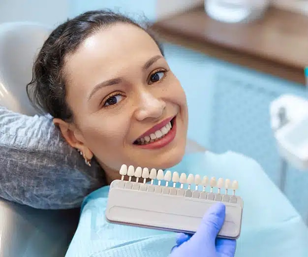 beautiful women checking the veneers color options in ventura